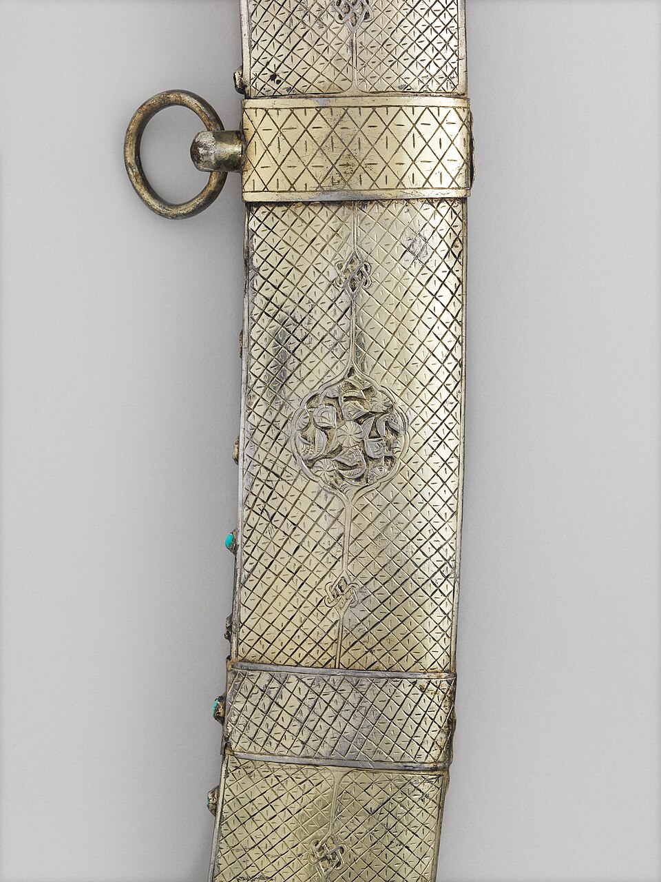 A curved Middle Eastern scimitar with scabbard showing fine craftsmanship